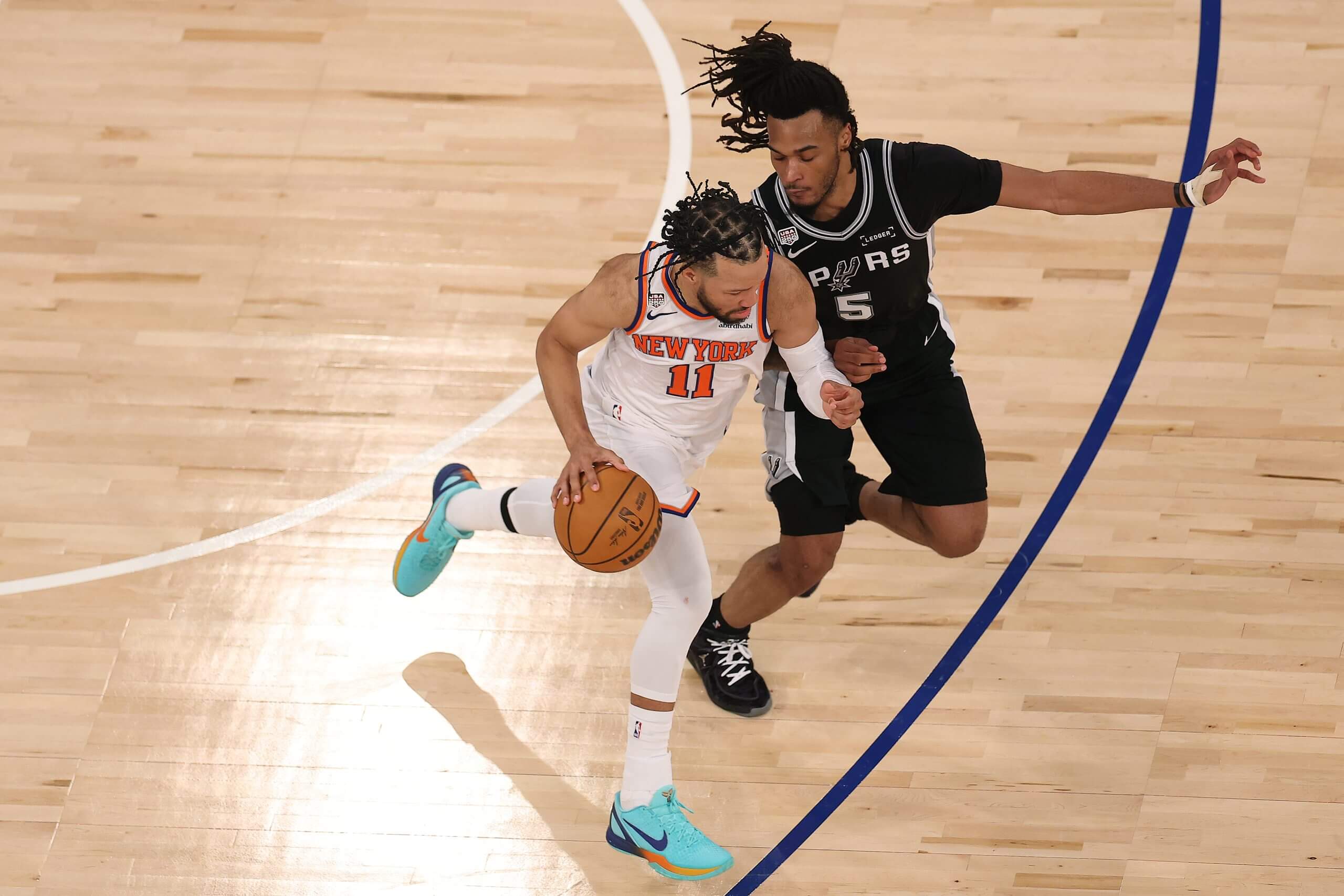 San Antonio's Stephon Castle was one of the guards puts pressure on New York's Jalen Brunson.
