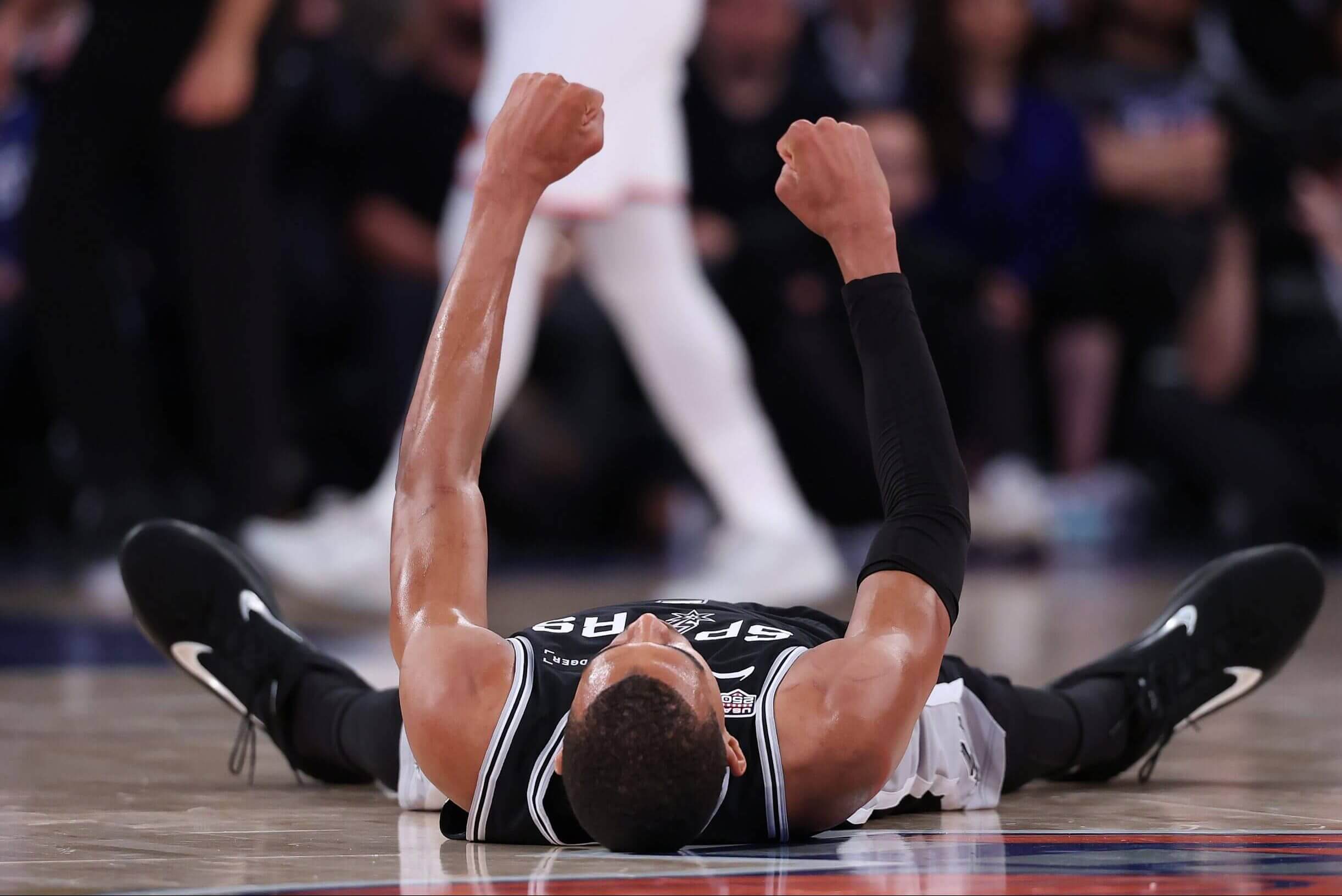 San Antonio's Victor Wembanyama raises his fists during Game 3 of the 2026 NBA Finals in New York.