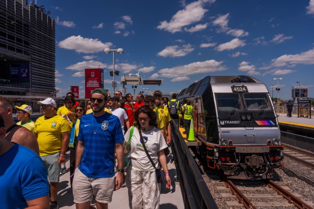 Soccer fans exit a NJ Transit train at Meadowlands as they arrive at MetLife Stadium on June 13, 2026 in East Rutherford, New Jersey. (Photo by Adam Gray/Getty Images)