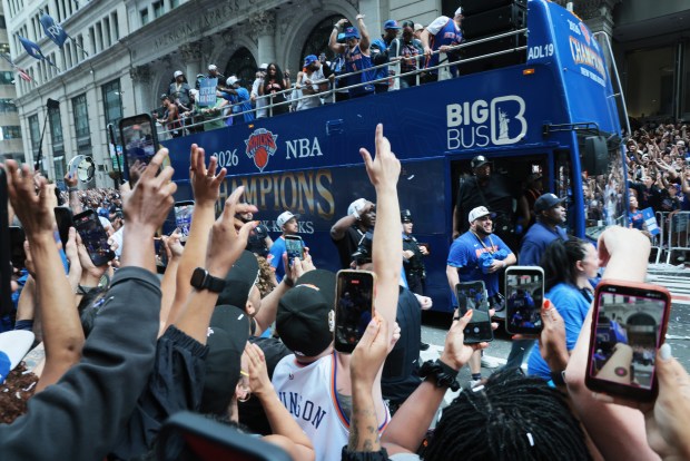 Thousands of fans cheer during the New York Knicks Championship ticker tape parade and victory rally celebrating winning the 2026 NBA Finals on June 18, 2026 in New York City.
