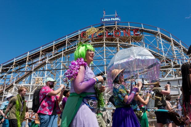 NEW YORK, NEW YORK - JUNE 20: Revelers participate in the annual Mermaid Parade at Coney Island on June 20, 2026 in the Brooklyn borough of New York City. Now in its 44th year, over 3,000 marchers and thousands of spectators came out for the event to celebrate the arts, the ocean and the Coney Island neighborhood and boardwalk in Brooklyn. (Photo by Spencer Platt/Getty Images)