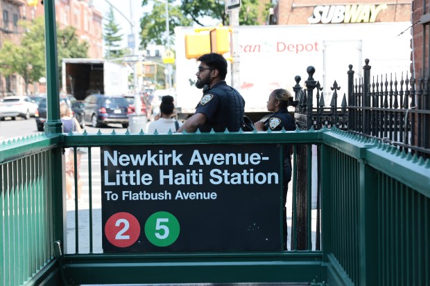 NEW YORK, NEW YORK - JUNE 25: NYPD officers stand guard outside of the the Newkirk Avenue-Little Haiti subway station on June 25, 2026 in the Little Haiti neighborhood of the Brooklyn borough in New York City. In a 6-3 ruling, the Supreme Court ruled in favor of the Trump administration's effort to strip temporary protected status (TPS) from hundreds of thousands of Haitians and Syrians, who were legally in the U.S. and protected from deportation, including many who have lived legally in the country for years. (Photo by Michael M. Santiago/Getty Images)