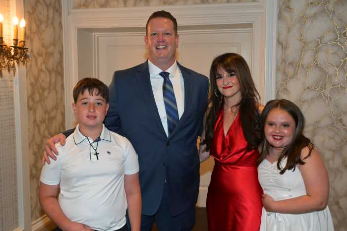 a family dressed up at a dinner dance