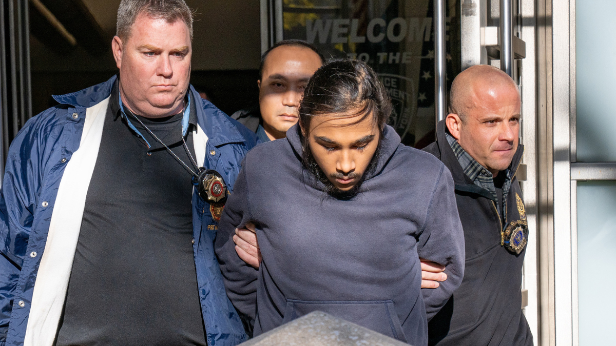 Hiram Carrero escorted by police on December 4, 2025.