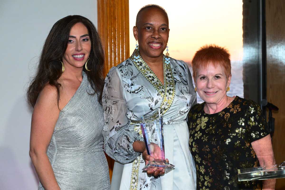Hon. Wavny Toussaint receives an award from  Brooklyn Women's Bar Association President Lisa Michael.