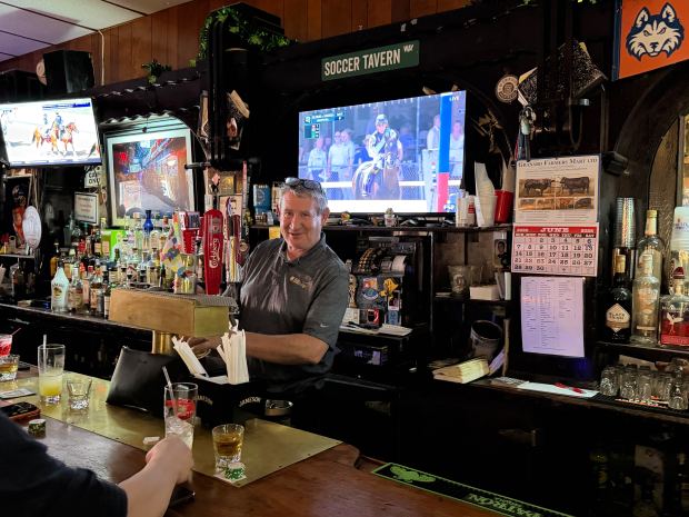 Bar owner and manager Brendan Farley pours a pint of Guiness at Soccer Tavern in Brooklyn. (Rose Abuin / New York Daily News)