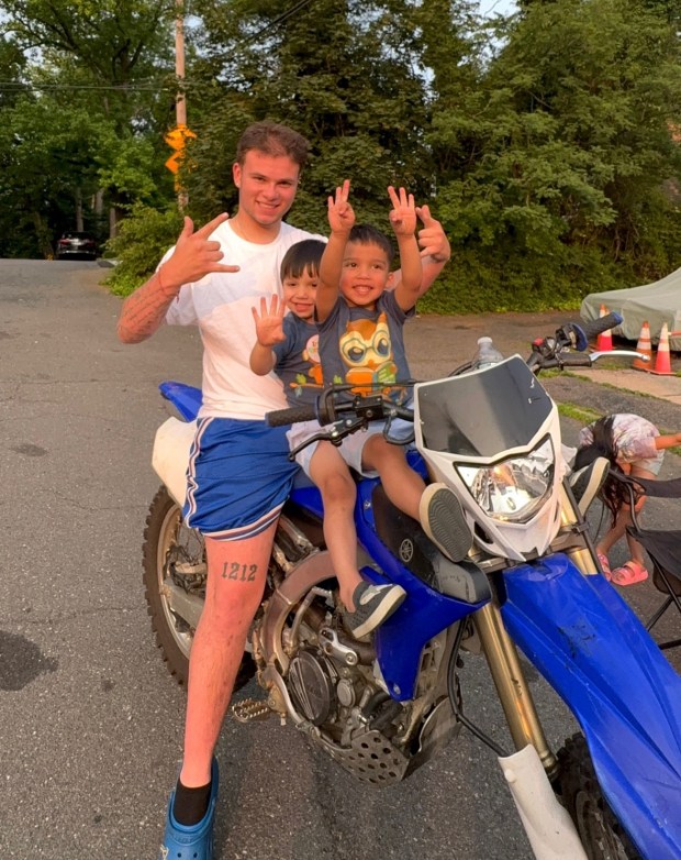 Jordan Yulfo is pictured with his 4-year-old twin nephews, Myles and Ryder Doyle, in an undated photo. (Photo courtesy of Justin Doyle)