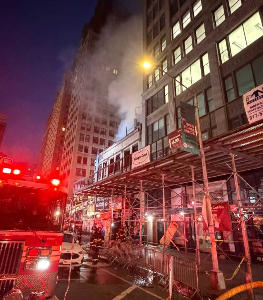 Three-alarm fire tears through Midtown building, leaving three injured