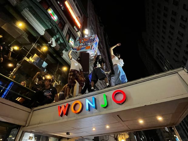 New York Knicks fans celebrate their team's NBA championship near Greeley Square in Manhattan early Sunday, June 14, 2026. (Julian Roberts-Grmela / New York Daily News)