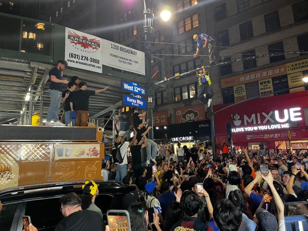 New York Knicks fans celebrate their team's NBA championship near Greeley Square in Manhattan early Sunday, June 14, 2026. (Julian Roberts-Grmela / New York Daily News)