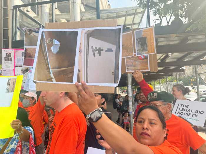Tenants hold images of broken doors and patched up cracks that have not been meaninfully repaired.