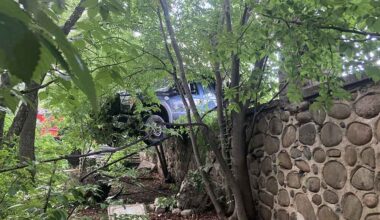 Bedford Park: One Arrested, One Injured in Crash as Truck Hangs Over Mosholu Parkway Wall