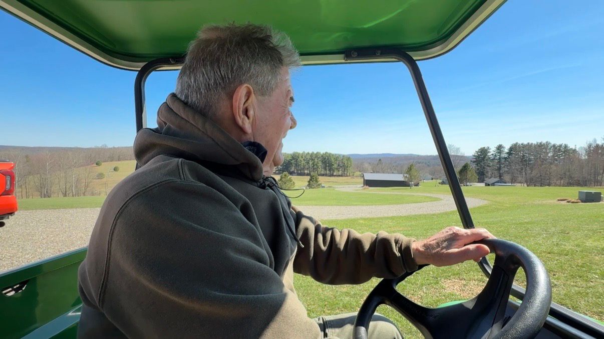 George Fish looks out over the land his family has lived on for generations, just outside of the proposed park. (Spectrum News/Natalie Mooney)