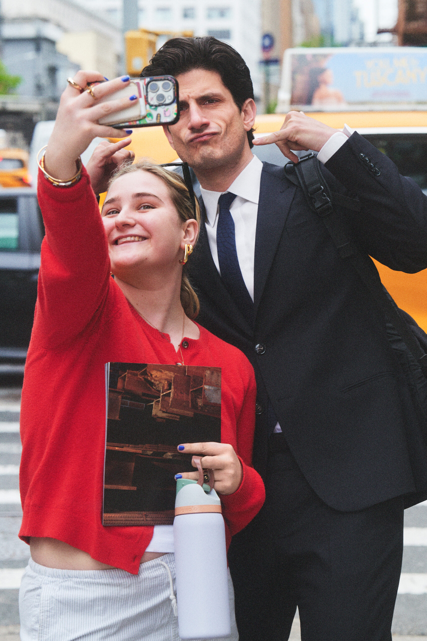 Jack Schlossberg takes a selfie with a young woman in New York City.