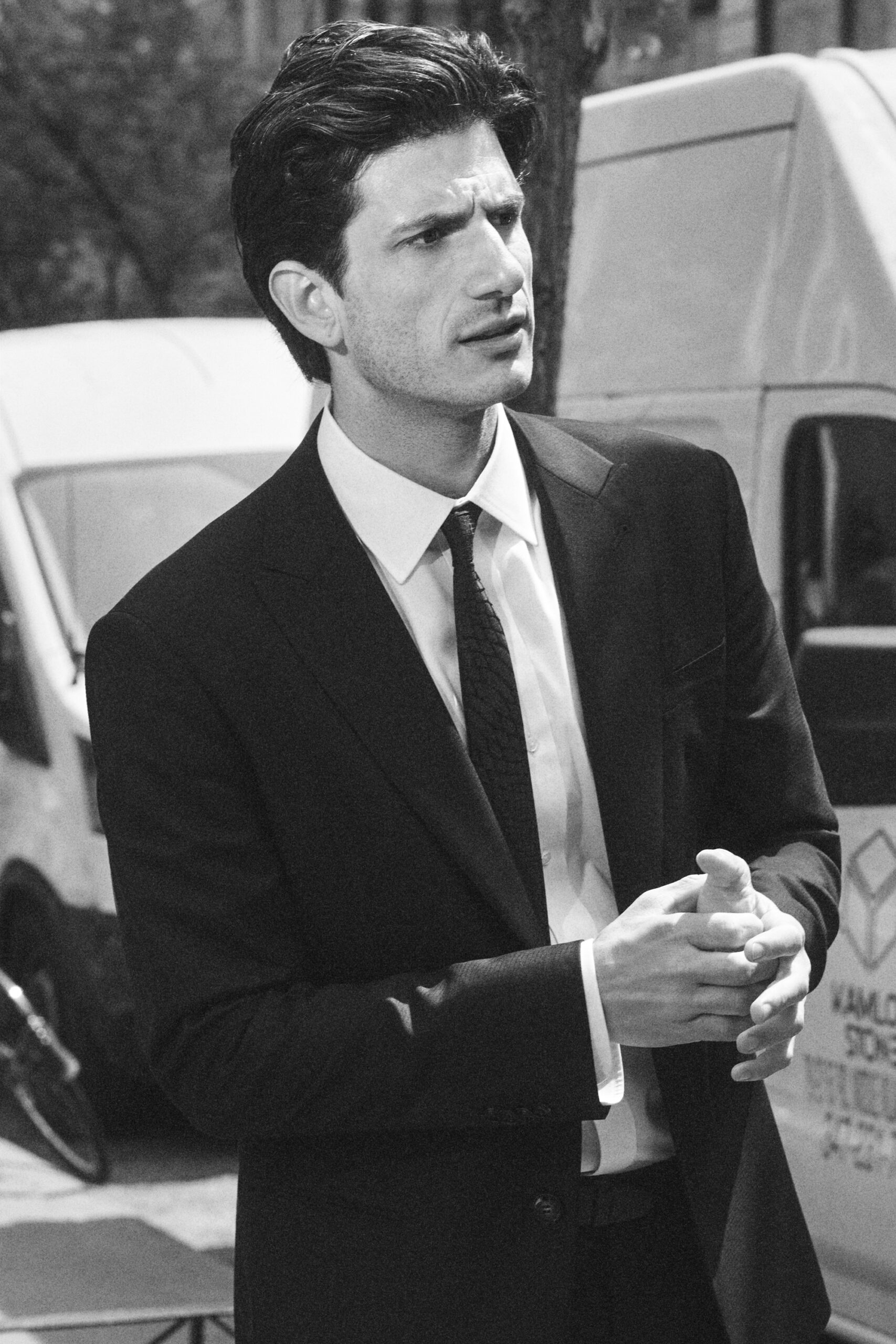 A black and white photo of Jack Schlossberg looking concerned.