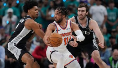 New York Knicks guard Jalen Brunson (11) spins as San Antonio Spurs guard Dylan Harper, left, defends during the first half of Game 1 of the NBA Finals basketball series on Wednesday, June 3, 2026, in San Antonio. (AP Photo/Eric Gay)