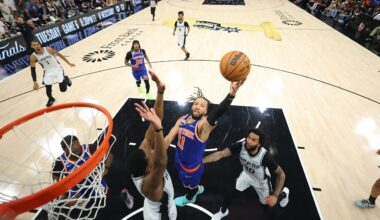 New York Knicks guard Jalen Brunson drives to the basket past San Antonio Spurs forward Julian Champagnie during the first half of Game 5 of the NBA Finals on Saturday, June 13, 2026, in San Antonio. (Geoff Burke/Pool Photo via AP)