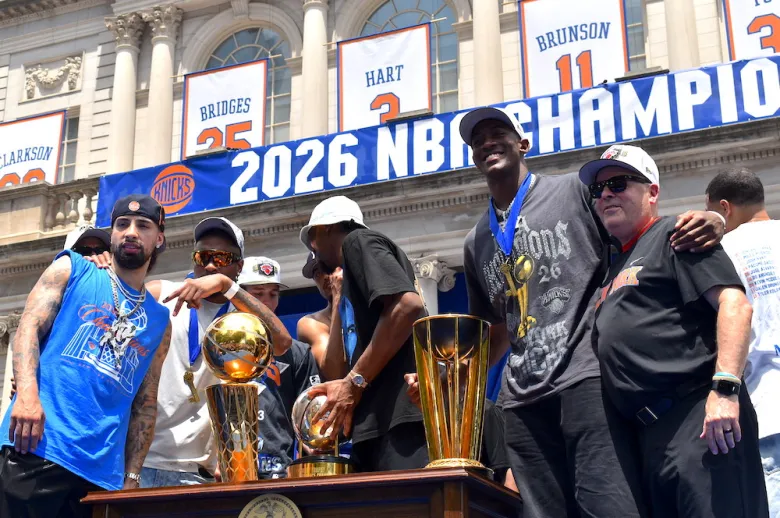 New York Knicks pose with their 2026 trophies at their City Hall celebration on June 18. (Ariama C. Long photo)