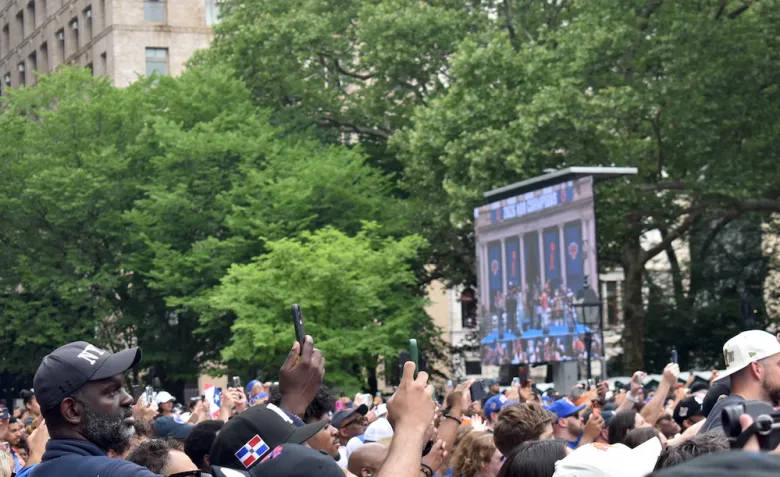 An excited crowd takes photos of the New York Knicks players arriving at the City Hall celebration after the parade on June 18, 2026. (Ariama C. Long photo)