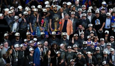 The New York Knicks pose with the Larry O'Brien Championship Trophy after defeating the San Antonio Spurs in Game 5 of the NBA Finals on Saturday, June 13, 2026, in San Antonio. (AP Photo/Ross D. Franklin)