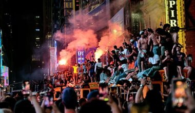 New York Knicks fans celebrate their victory after Game 5 of the NBA Finals basketball series against the San Antonio Spurs, Saturday, June 13, 2026, in New York. (AP Photo/Heather Khalifa)