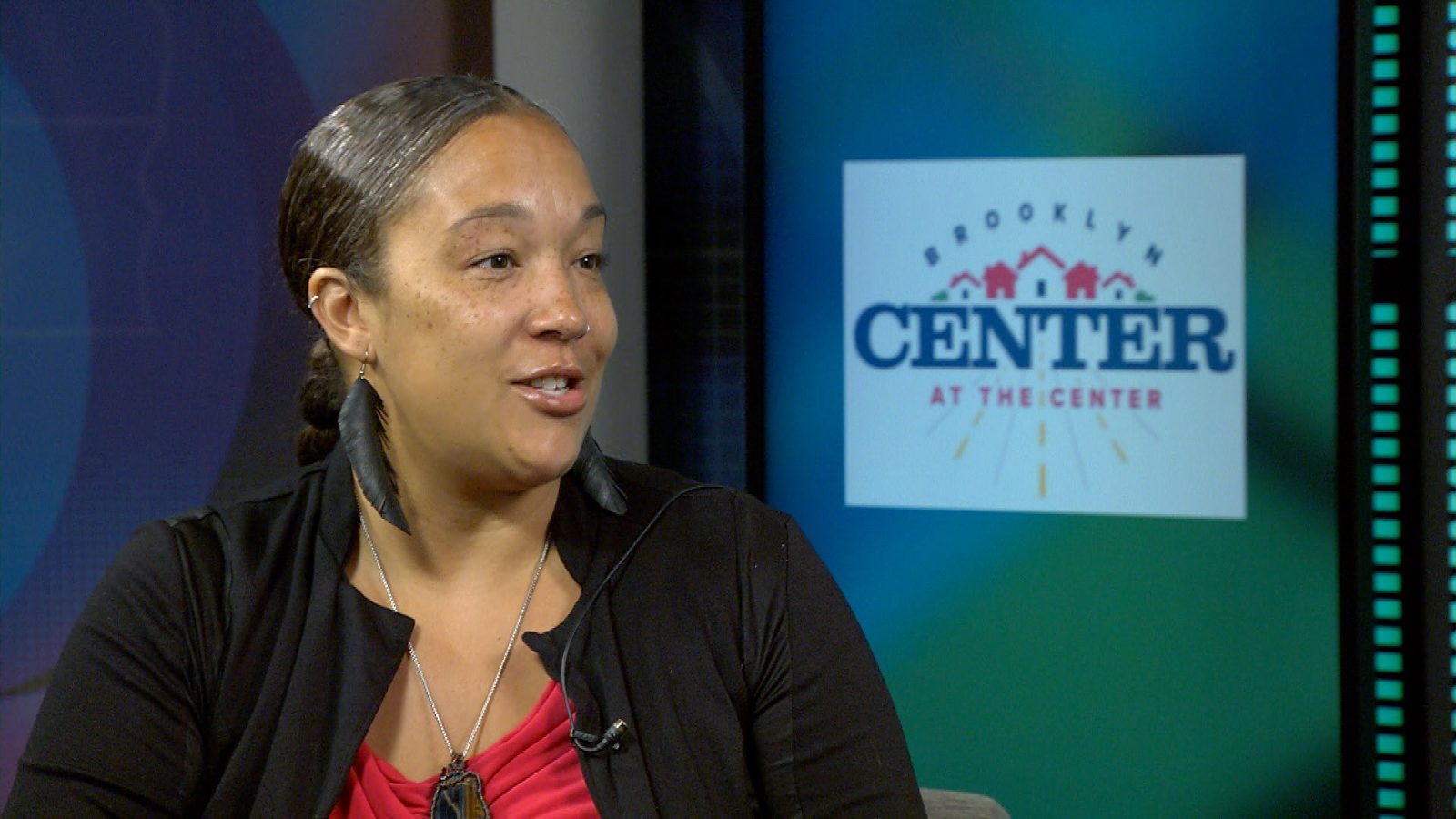 Woman being interviewed in a television studio