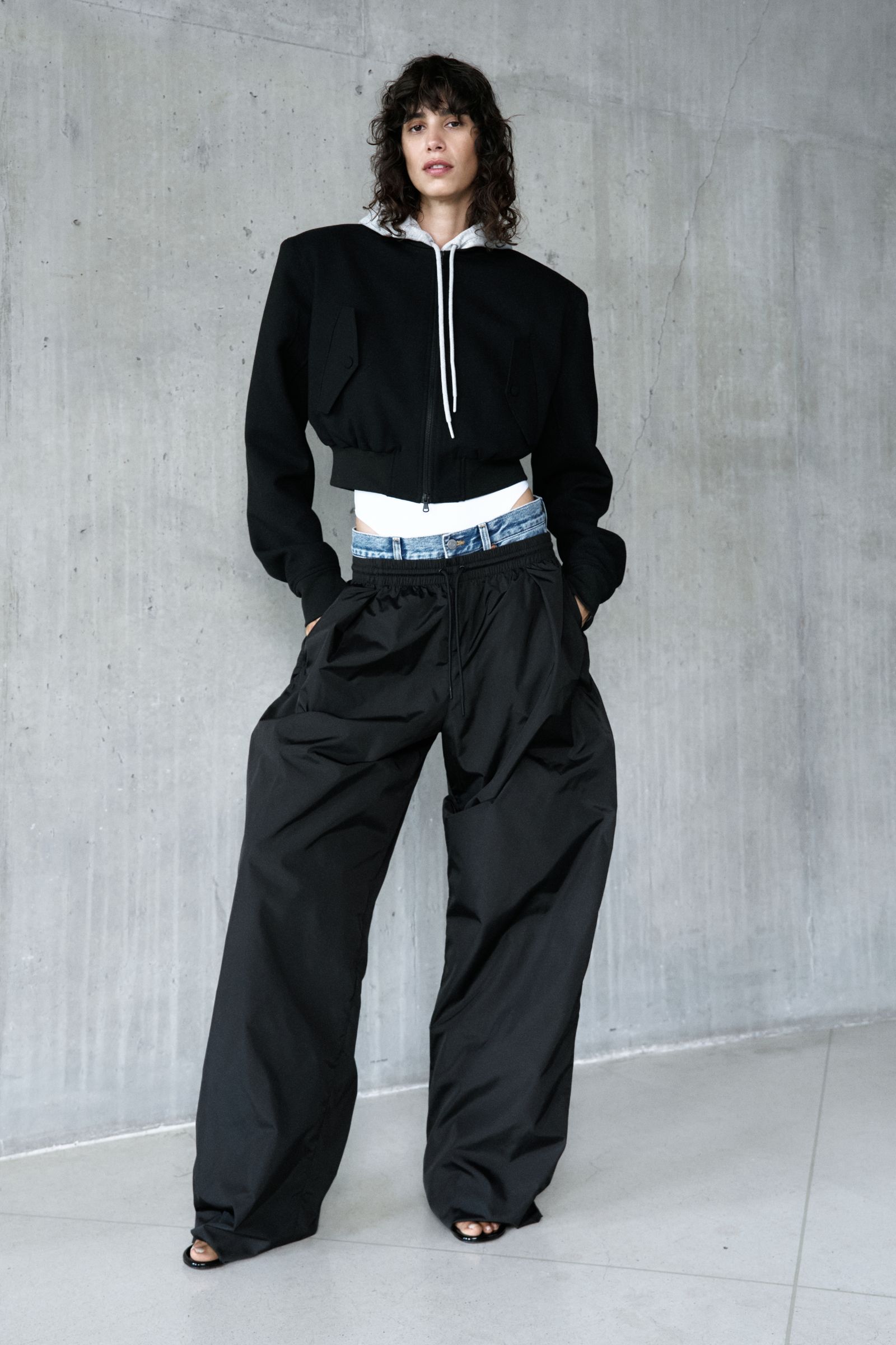 Image may contain Clothing Pants Formal Wear Suit Long Sleeve Sleeve Coat Adult and Person
