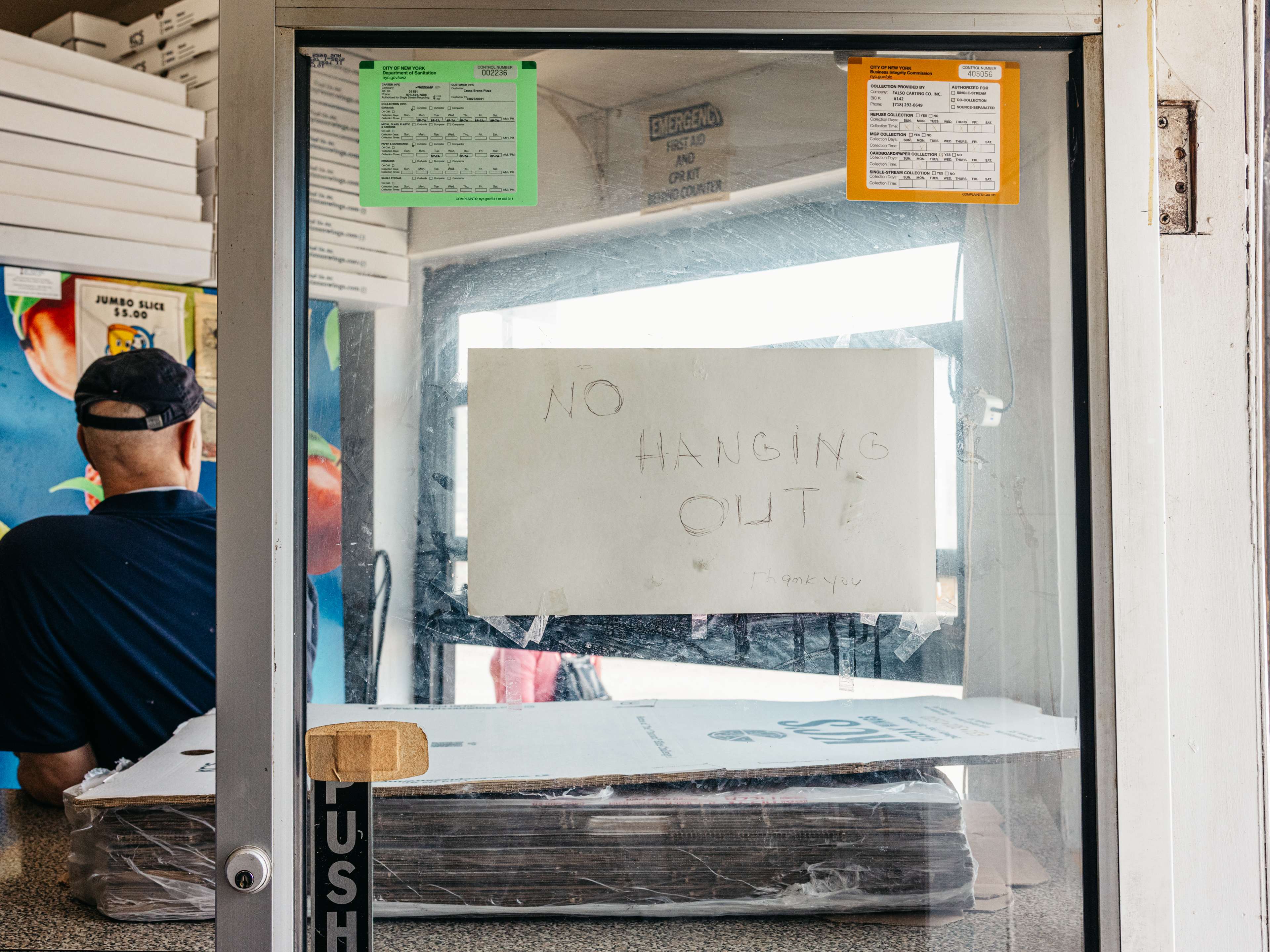 NO HANGIN OUT sign at Cross Bronx Pizzeria