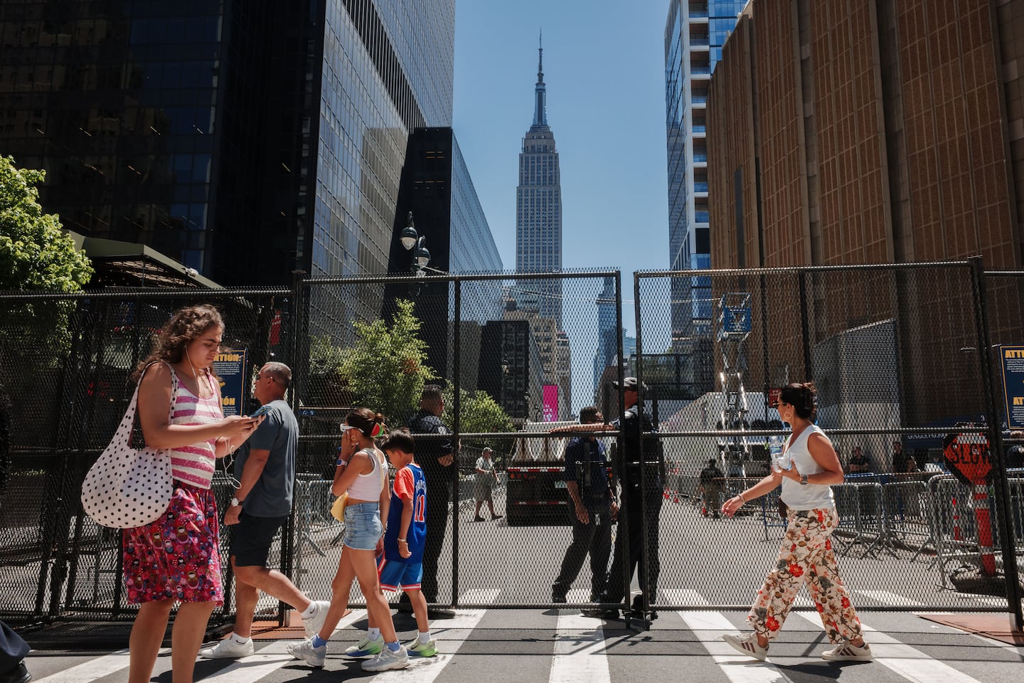 People walked near a security fence around Madison Square Garden ahead of Game 3 of the NBA Finals between New York Knicks and San Antonio Spurs, on Monday.