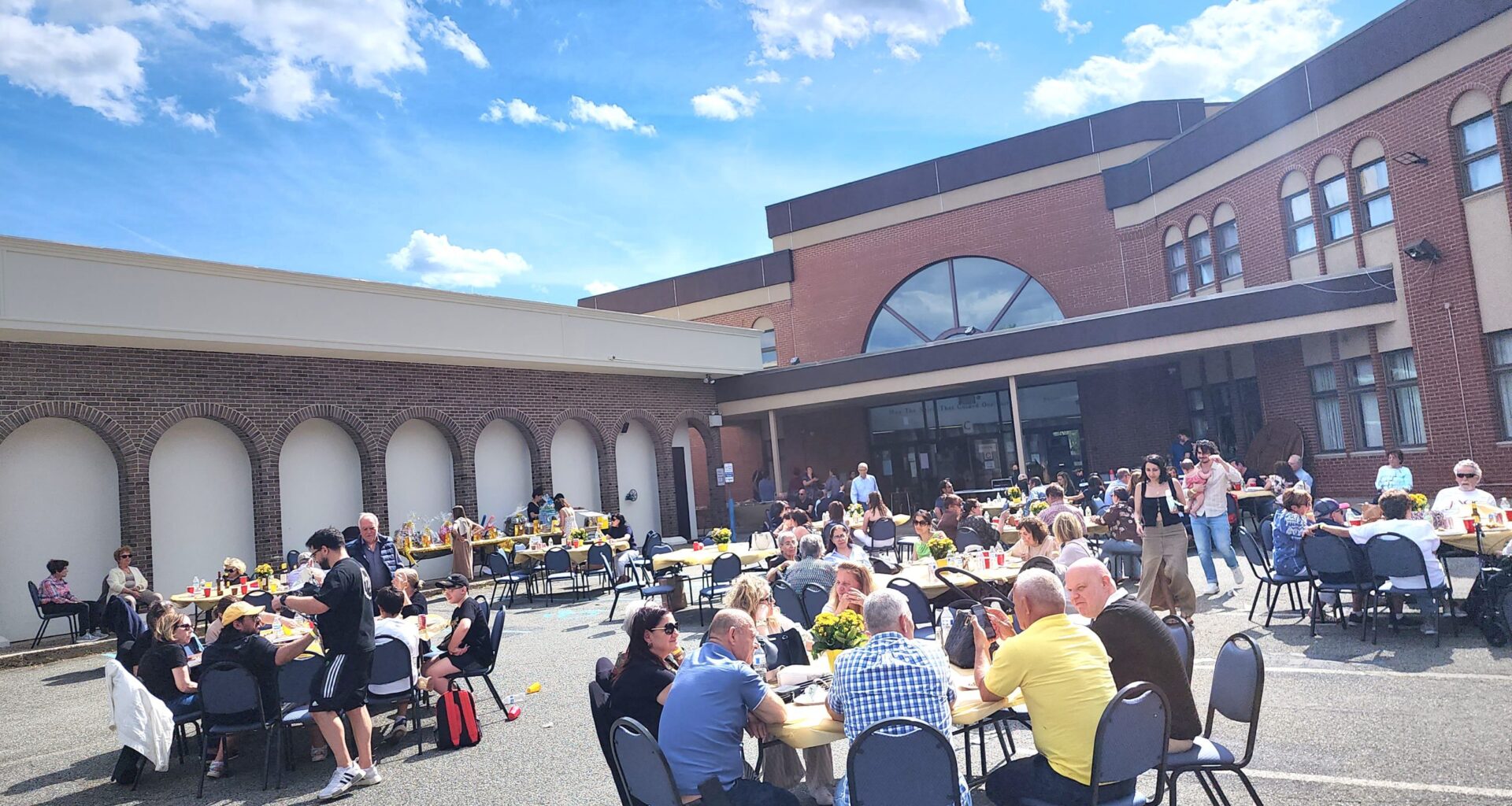 In the courtyard of Holy Trinity-St. Nicholas Church, members and friends of the Pancyprian Association Aphrodite of Staten Island at the annual summer barbecue. Photo: TNH/Michael Kakias