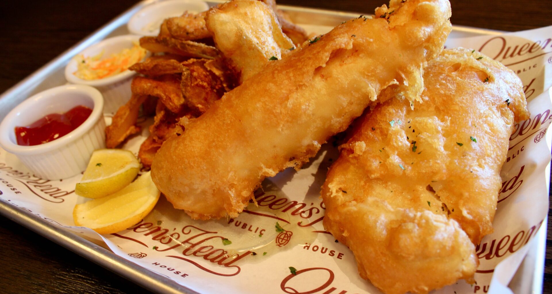 Queen's Head Pub fish and chips with two large fried cod filets.