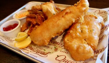 Queen's Head Pub fish and chips with two large fried cod filets.