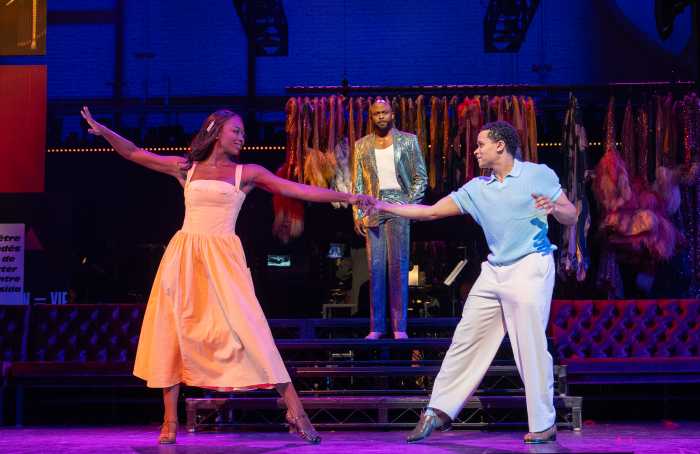 three actors on stage