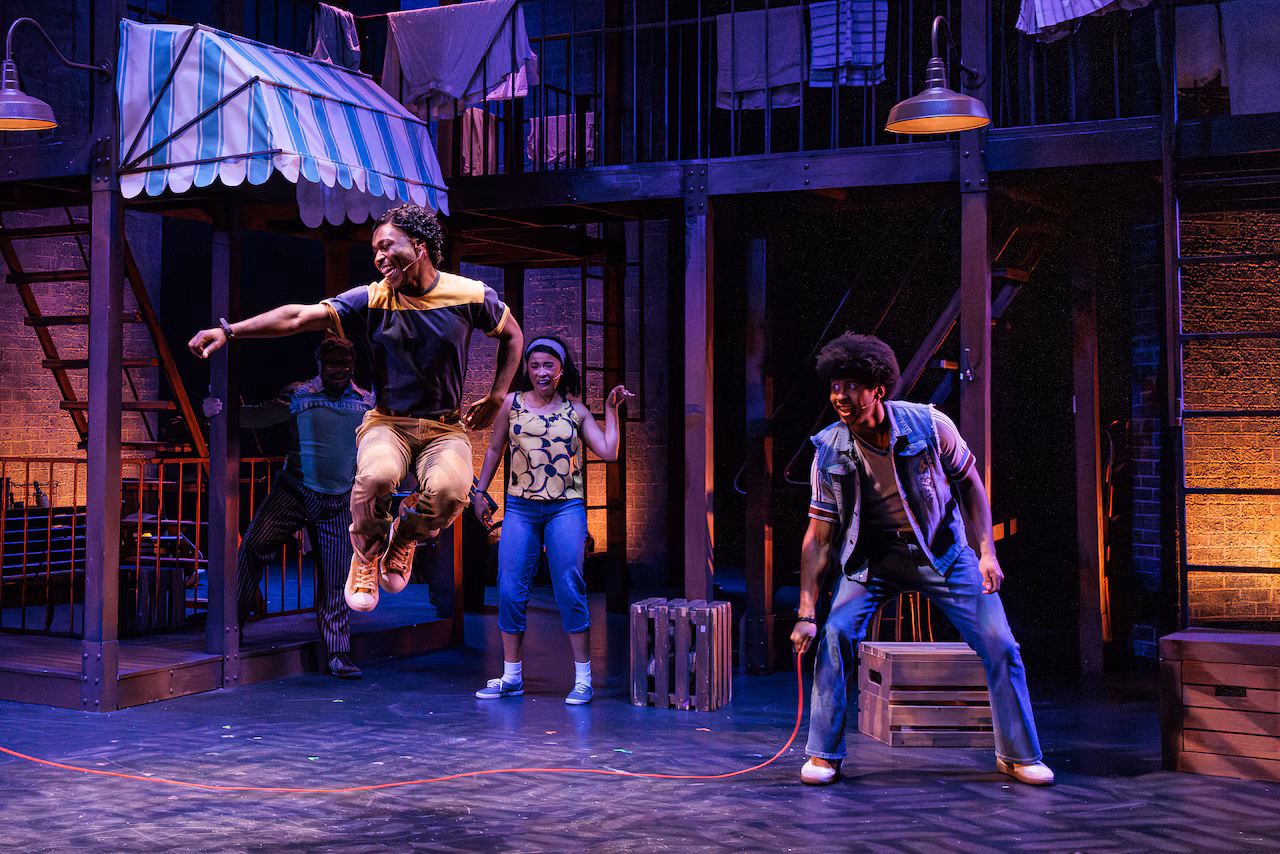 Miracle Myles as Tyrone, Tuesday Usry as Denise, and Christian Perkins as Jesse in The REV Theatre Company’s production of “A Bronx Tale.”