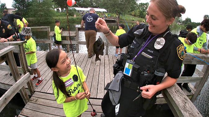 Brooklyn Park Police Reel in the Fun at Kids Fishing Event
