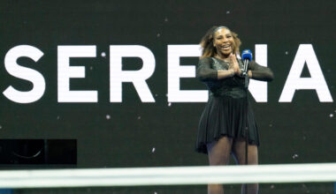 Serena Williams behind a Serena sign