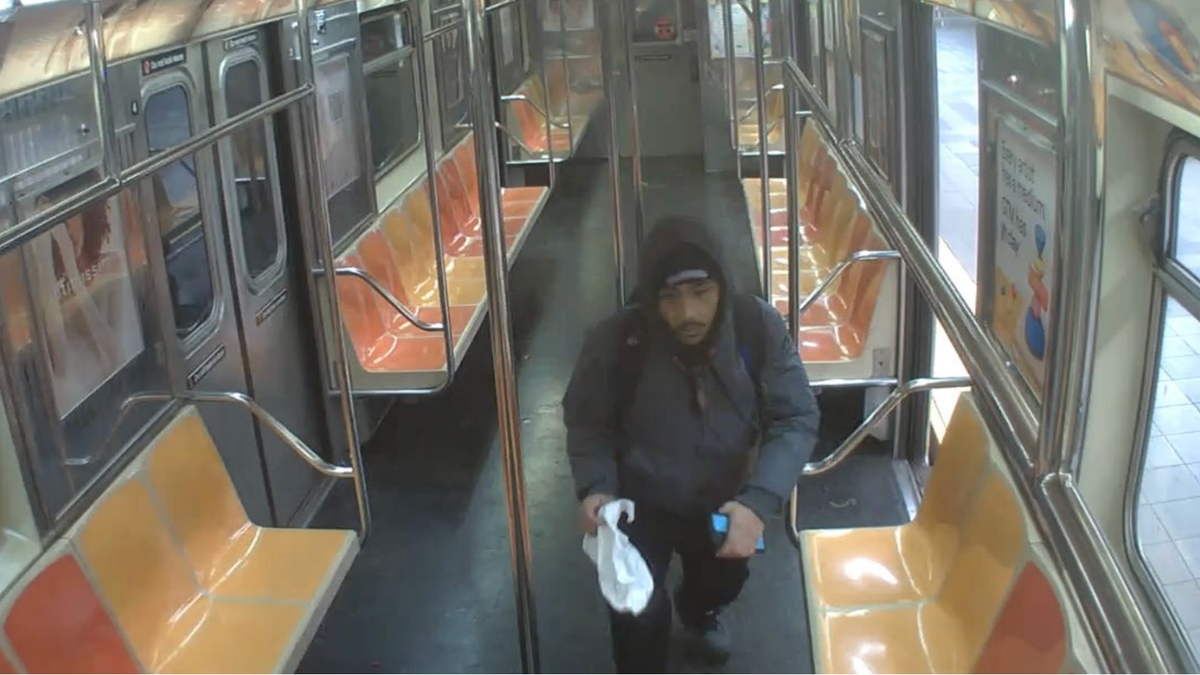 Hiram Carrero is seen on the train car shortly before setting the fire