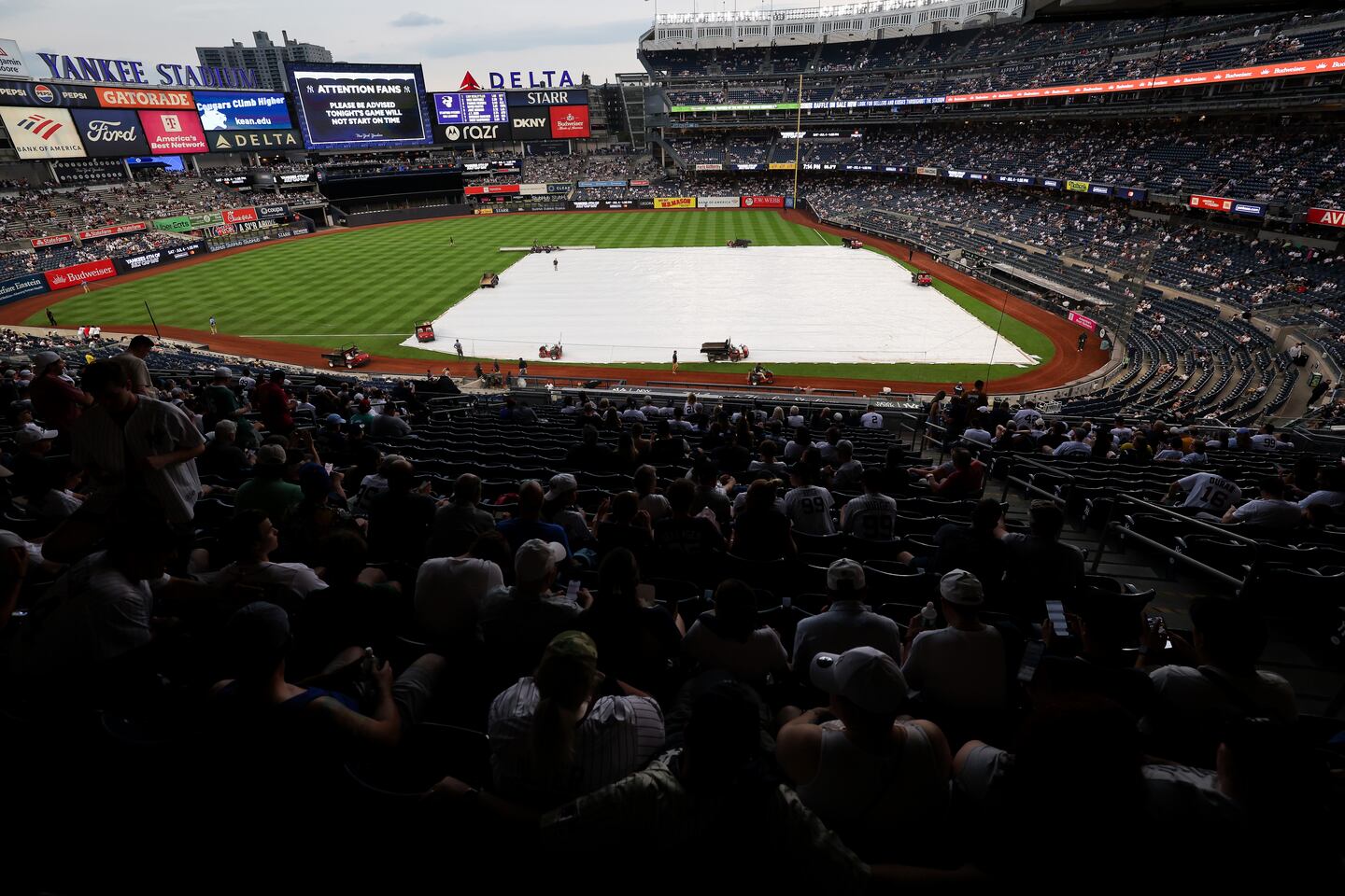 A torrential downpour forced the postponement of Saturday night's game between the Red Sox and Yankees at Yankee Stadium.