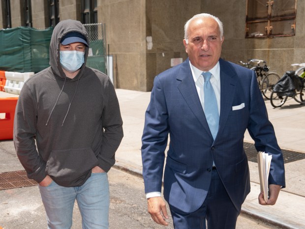 Former NYPD Officer Matthew Lambert, left, leaves Manhattan Criminal Court Wednesday, June 10, 2026 in Manhattan, New York, alongside his attorney, Jake Lasala. (Barry Williams/ New York Daily News)