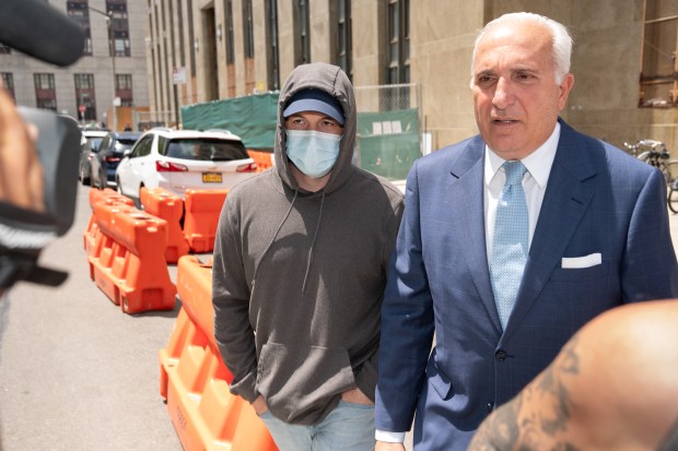 Former NYPD Officer Matthew Lambert, left, leaves Manhattan Criminal Court Wednesday, June 10, 2026 in Manhattan, New York, alongside his attorney, Jake Lasala. (Barry Williams/ New York Daily News)
