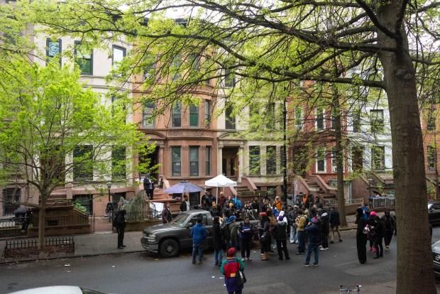 Protesters gather outside the home of Carmella Charrington at 212 Jefferson Ave. in Brooklyn, New York, on Wednesday, April 22, 2026. (Gardiner Anderson / New York Daily News)
