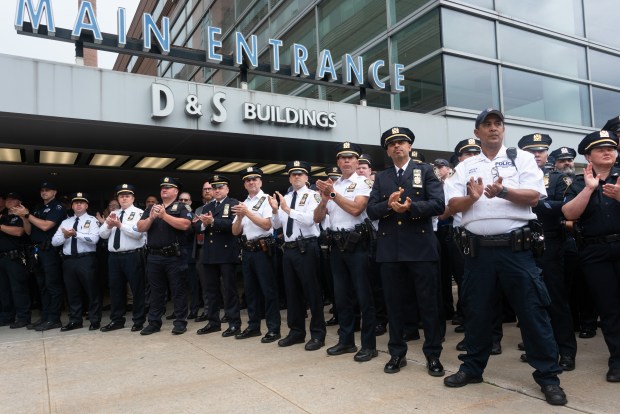 NYPD members applaud as Det. Matthew Gale is discharged from Kings County Hospital Center in Brooklyn, New York on Tuesday, June 23, 2026. (Gardiner Anderson / New York Daily News)