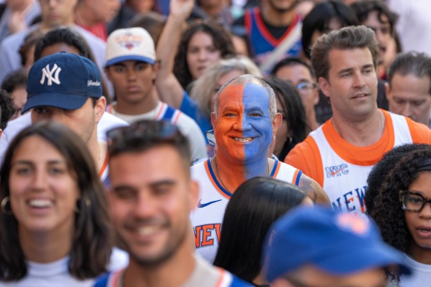 Knicks fans pose for a photo on W. 34th St. stuck in a crowd near Madison Square Garden Monday, June 8, 2026 in Manhattan, New York. (Barry Williams/ New York Daily News)