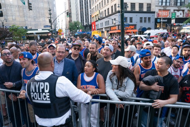 Knicks fans wait to be screened by the NYPD on W. 33rd St. outside Madison Square Garden on Monday, June 8, 2026 in Manhattan. (Barry Williams/ New York Daily News)
