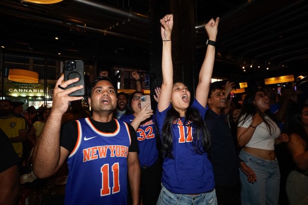 Knicks fans cheer in a Midtown Manhattan bar as the Knicks win the NBA Finals on Saturday, June 13, 2026. (Barry Williams/ New York Daily News)