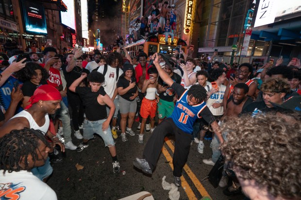 New York Knicks fans celebrate in Times Square after the Knicks defeated the San Antonio Spurs in the NBA Finals on Saturday, June 13, 2026 in Manhattan, New York. (Barry Williams/ New York Daily News)