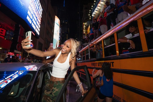 New York Knicks fans celebrate in Times Square after the Knicks defeated the San Antonio Spurs in the NBA Finals on Saturday, June 13, 2026 in Manhattan, New York. (Barry Williams/ New York Daily News)