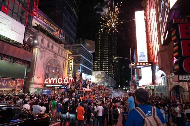 New York Knicks fans celebrate in Times Square after the Knicks defeated the San Antonio Spurs in the NBA Finals on Saturday, June 13, 2026 in Manhattan, New York. (Barry Williams/ New York Daily News)