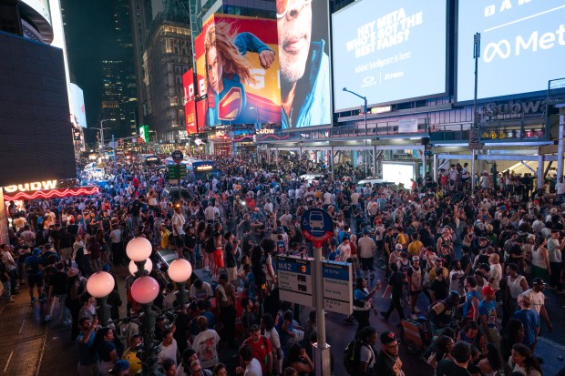 New York Knicks fans celebrate in Times Square after the Knicks defeated the San Antonio Spurs in the NBA Finals on Saturday, June 13, 2026 in Manhattan, New York. (Barry Williams/ New York Daily News)