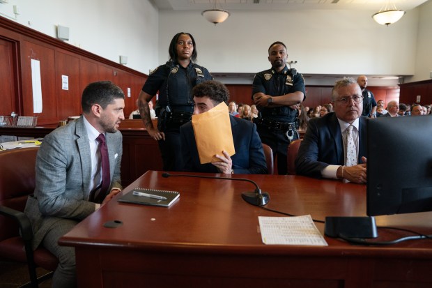 Luigi Mangione (center) is pictured in Manhattan Supreme Court with his legal team on Wednesday, June 17, 2026, in New York City. (Barry Williams / New York Daily News)